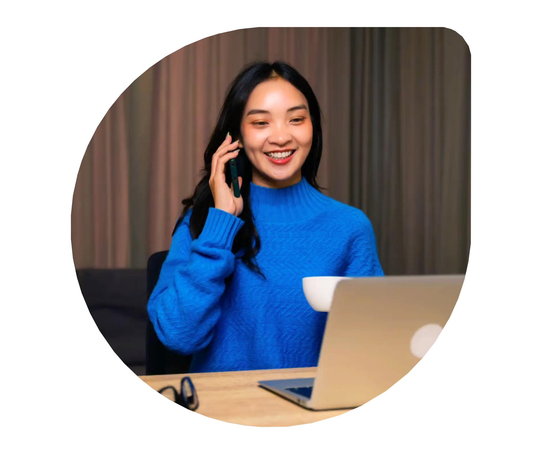 A MyOutDesk virtual assistant on a call, working at her laptop